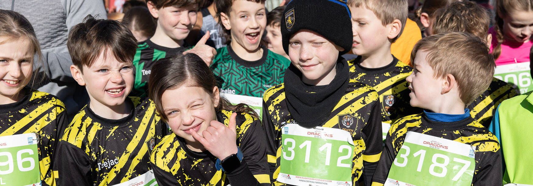 Returning for 2026, the hugely popular Dragon’s Dash/Ras y Ddraig junior race welcomes over 200 young runners, The event now takes place at the Anglesey Showground, right in the heart of Anglesey.