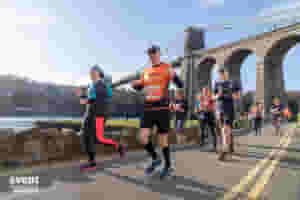 The most beautiful half marathon in North Wales! Flanked by breathtaking views of (Snowdonia) and the Menai Straits, the beauty and uniqueness of this event is what draws people from all over the UK!