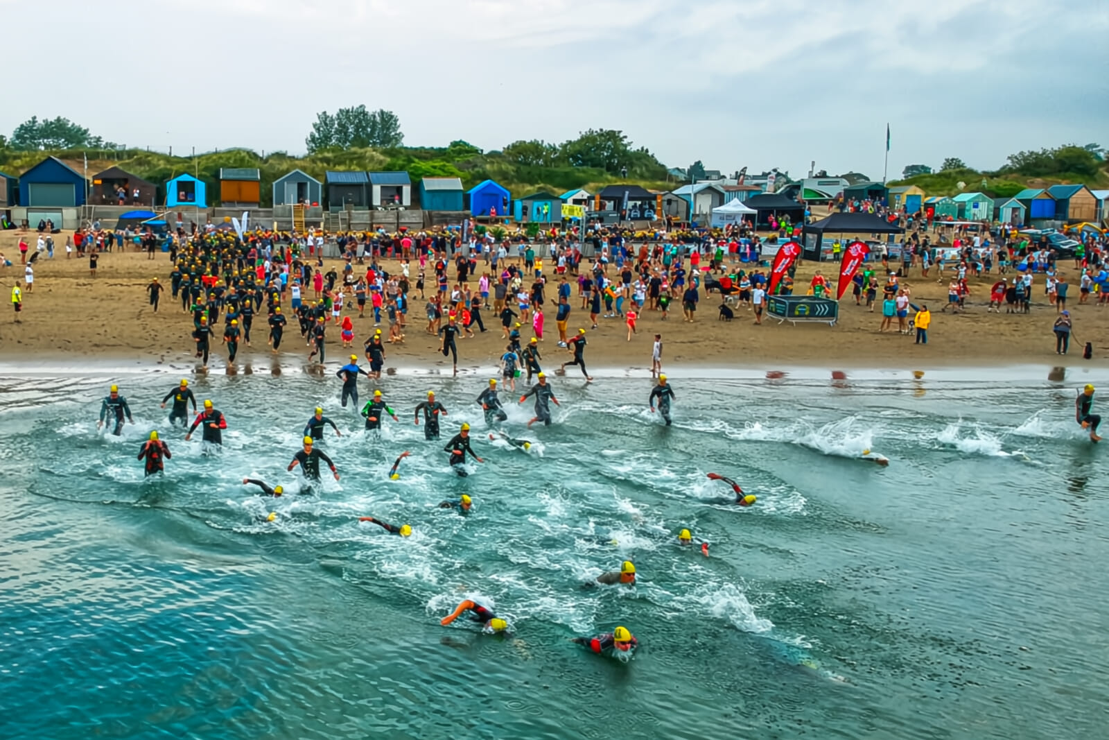 Experience a sheltered sea swim, ride scenic coastal roads, and a multi-terrain run to a stunning beach finish in an unforgettable triathlon with electric atmosphere and standout support.