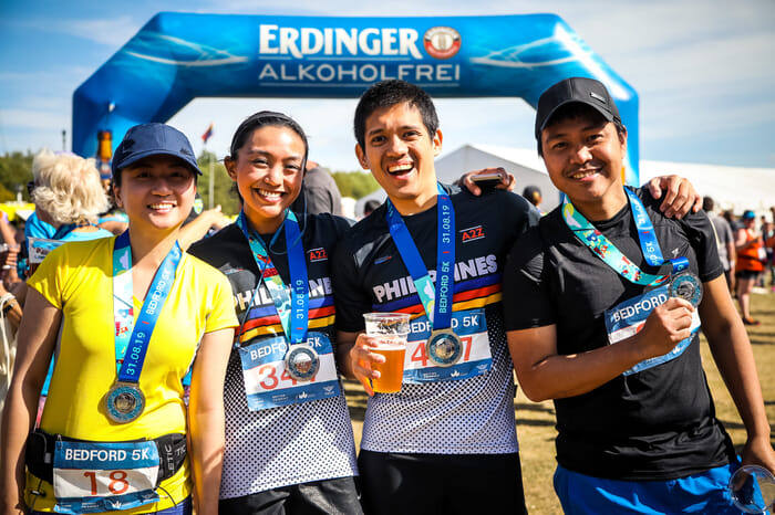 runners with medals and beer