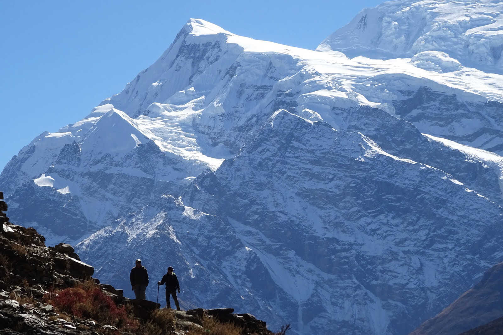 silhouette of hikers in annapurnas ii 48
