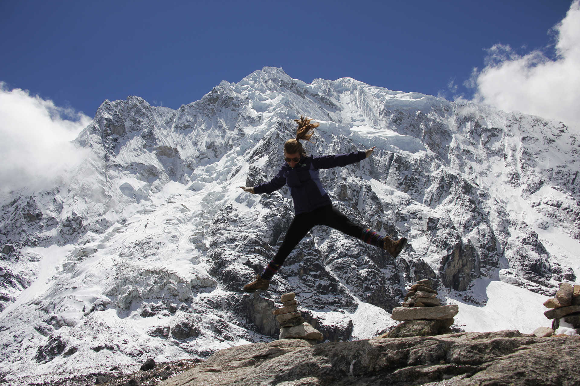hiker jumping in front of the salkantay glacier 878