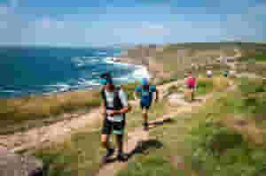 Man vs Coast is a 25-mile adventure run in Cornwall featuring natural obstacle challenges such as sea wades and coasteering for the adventurer who wants to make a weekend of it.